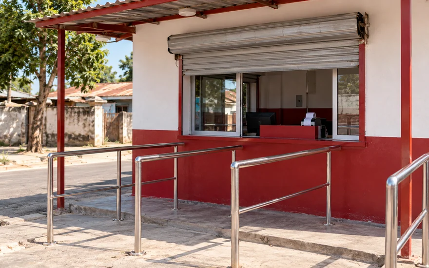 The service opening and queue rails of an unbranded mobile-money booth